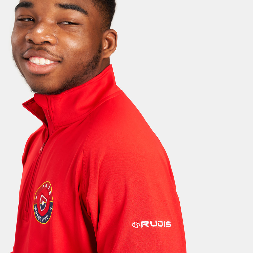 A smiling young man wearing a bright red athletic jacket with a zippered collar and branding on the sleeve
