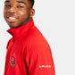 A smiling young man wearing a bright red athletic jacket with a zippered collar and branding on the sleeve