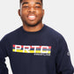 A smiling young man wears a navy blue sweatshirt emblazoned with PRTC WRESTLING in bold colors on the front