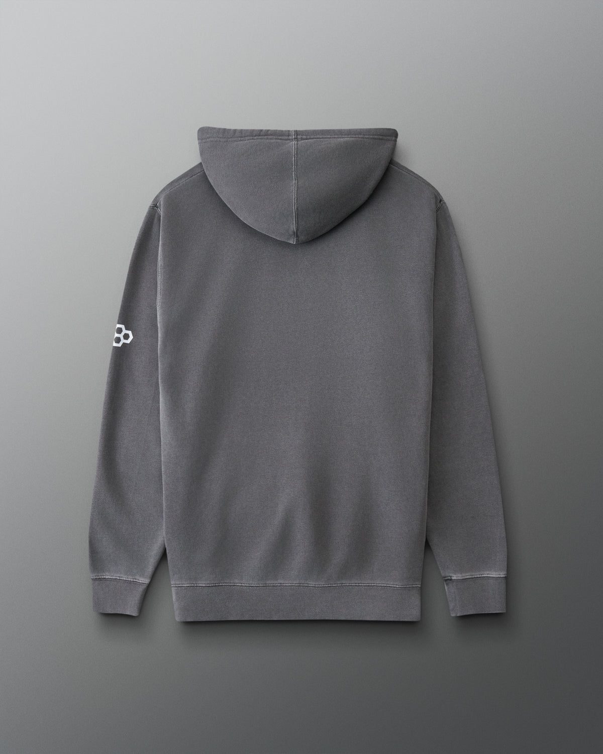 A dark gray pullover hoodie shown from the back, featuring a small white geometric logo on the left sleeve, set against a dark gray gradient background.