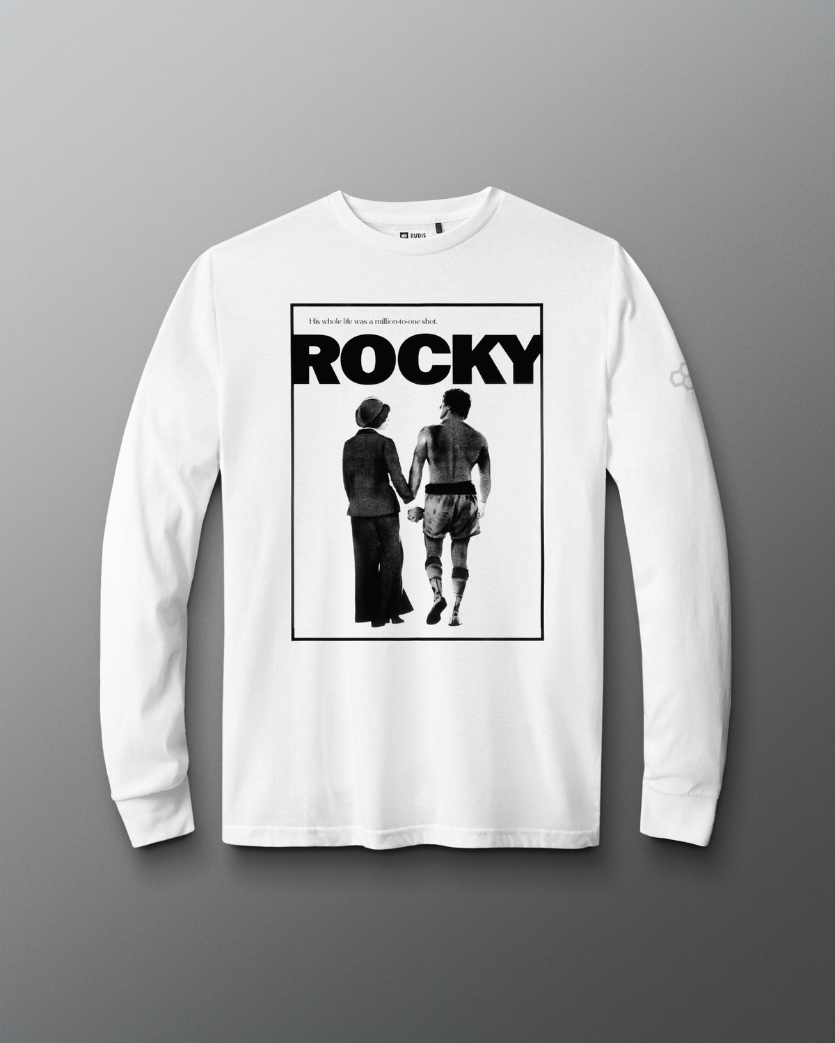 A white long-sleeve t-shirt with a black graphic print of the Rocky movie poster on the front, displayed against a neutral gray background.