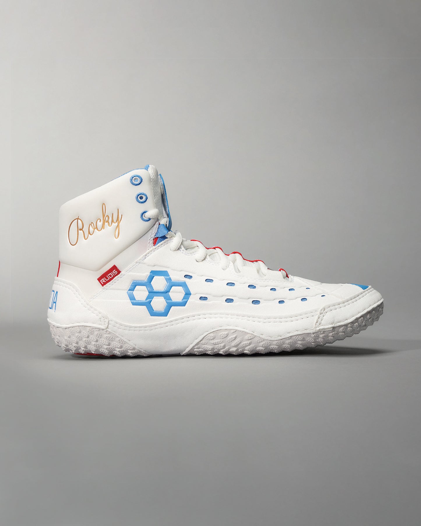 A stylish high-top white athletic shoe featuring blue accents and a distinctive Rocky embroidery on the collar for a unique look