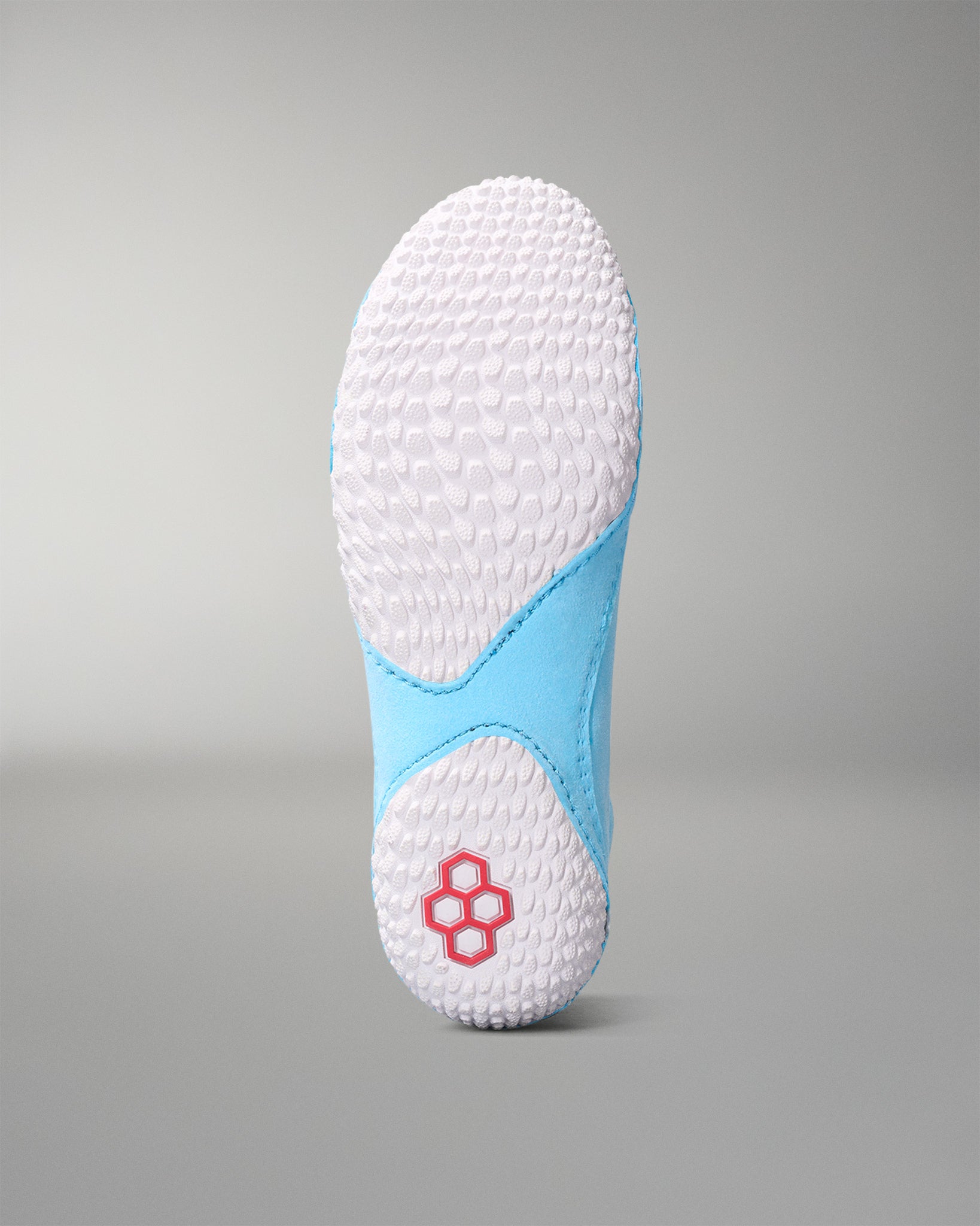 White sole with blue border on a gray background