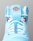 Light blue wrestling shoe with white laces and red accents on a gray background