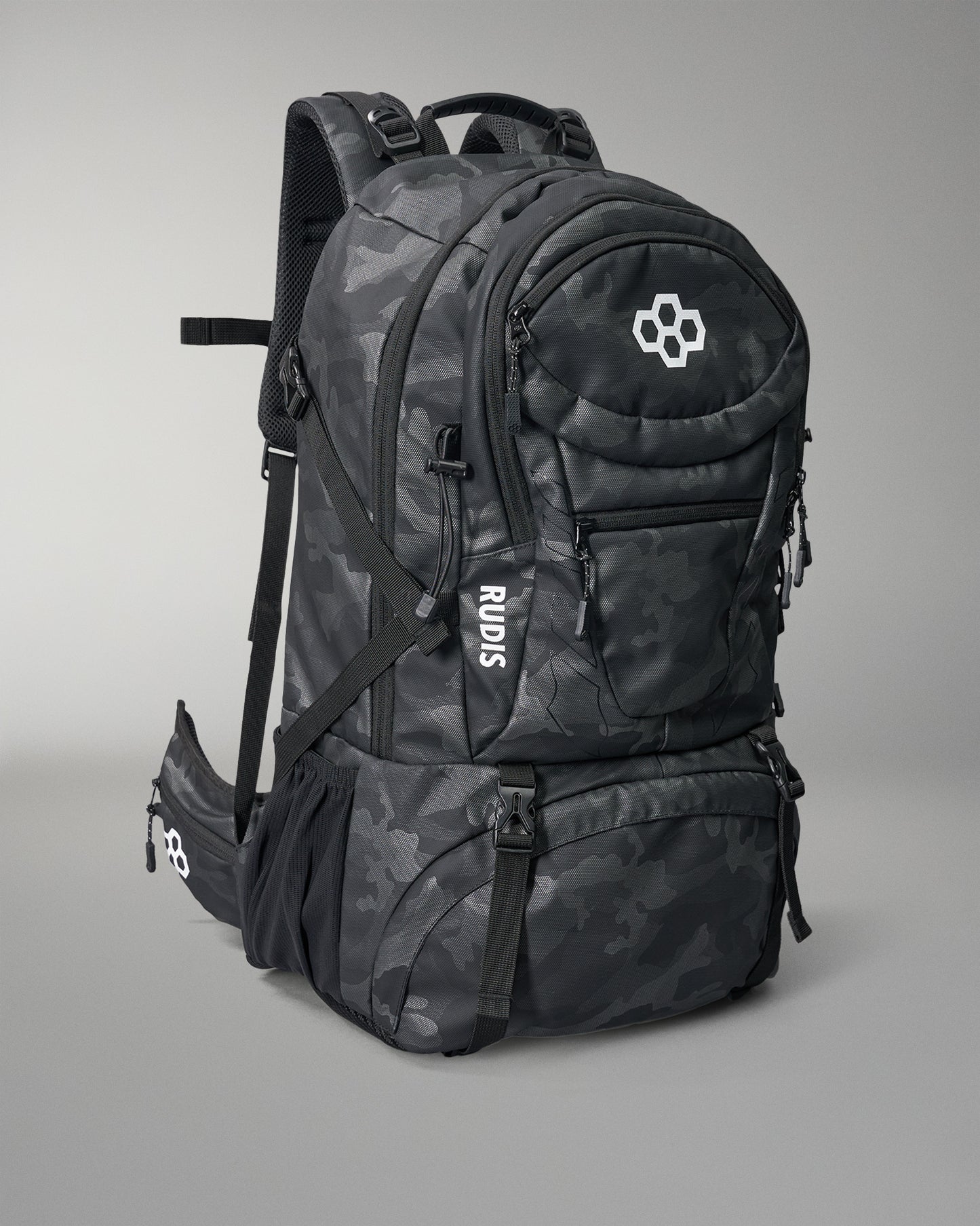 Black camouflage backpack with visible branding on a gray background