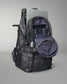 Camouflage backpack with open front pocket on a gray background
