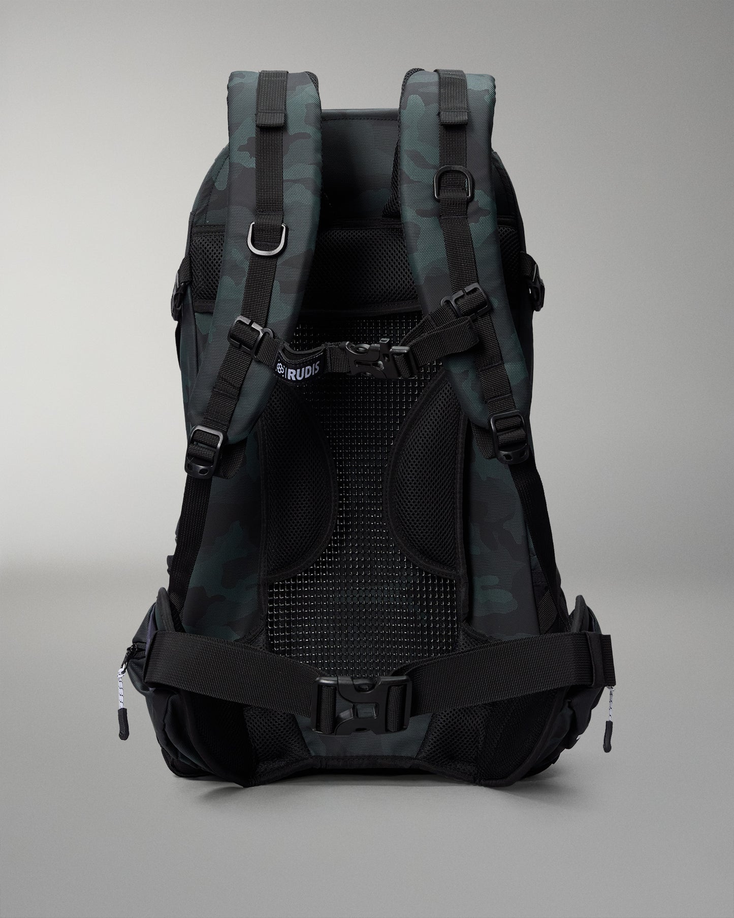 Green Camo and gray camouflage backpack on a gray background