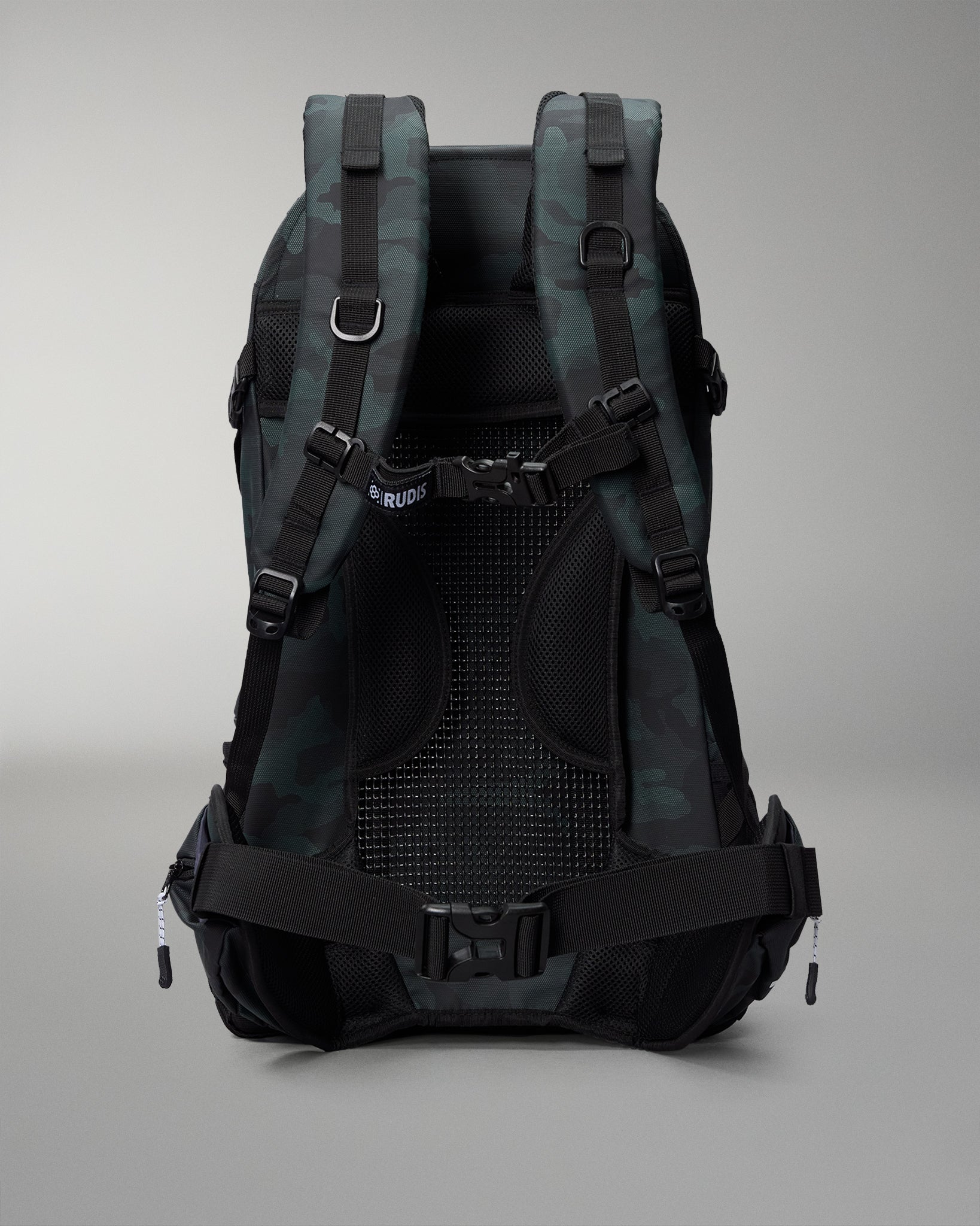Green Camo and gray camouflage backpack on a gray background