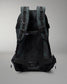 Green Camo and gray camouflage backpack on a gray background