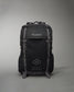 A durable black backpack designed for athletes featuring the brand name RUDIS prominently displayed and motivational text about building a healthy lifestyle