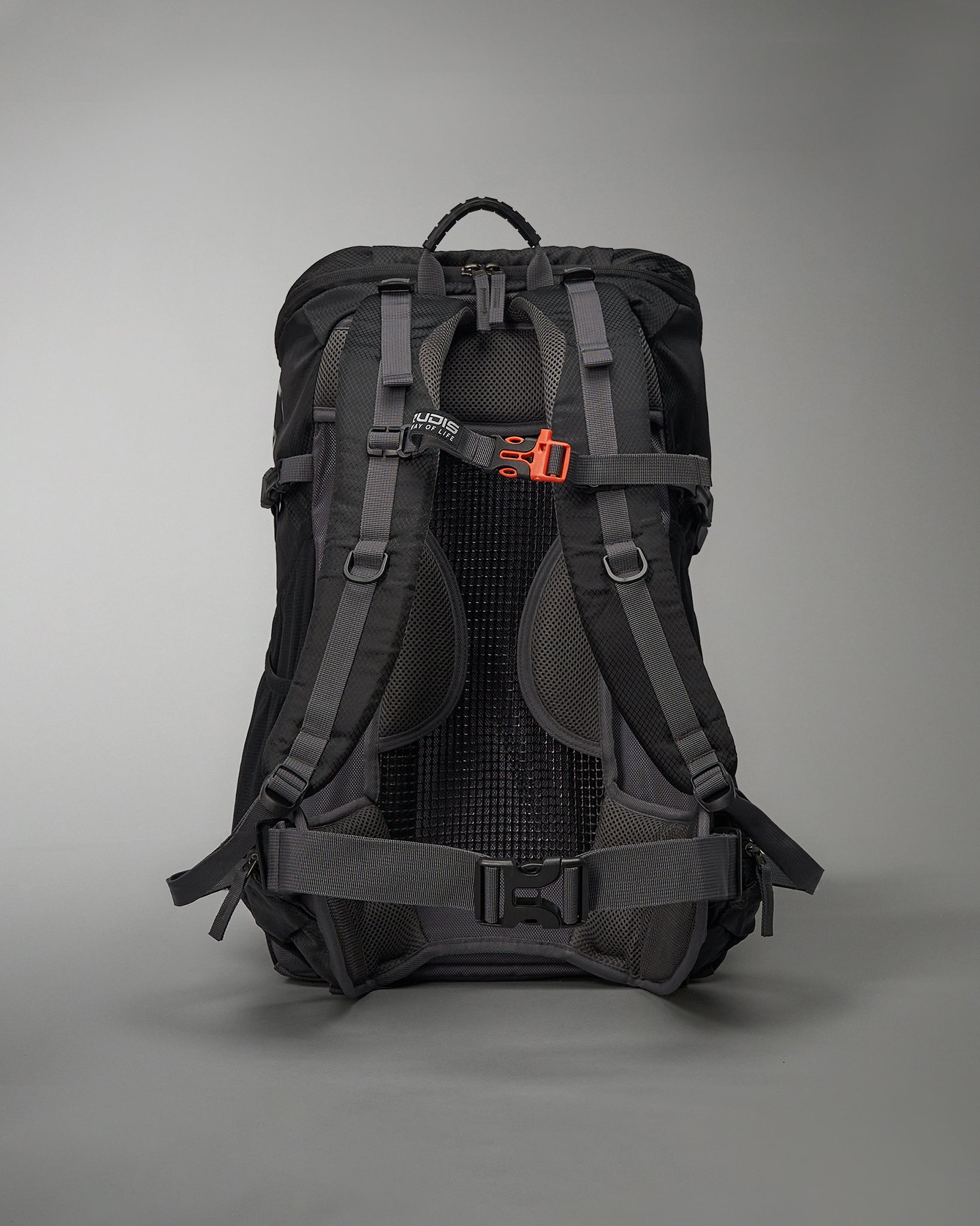 A sleek black backpack designed for outdoor adventures featuring padded straps a mesh back panel and an adjustable buckle for comfort and stability