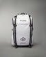 A sleek white backpack designed for athletes featuring the brand name RUDIS prominently displayed and additional motivational text emphasizing a lifestyle built for athletes