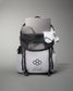 A stylish athletic backpack filled with gym clothes socks and a laptop featuring a motivational phrase