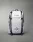 A sleek white backpack designed for athletes featuring the brand name RUDIS prominently displayed and additional motivational text emphasizing a lifestyle built for athletes