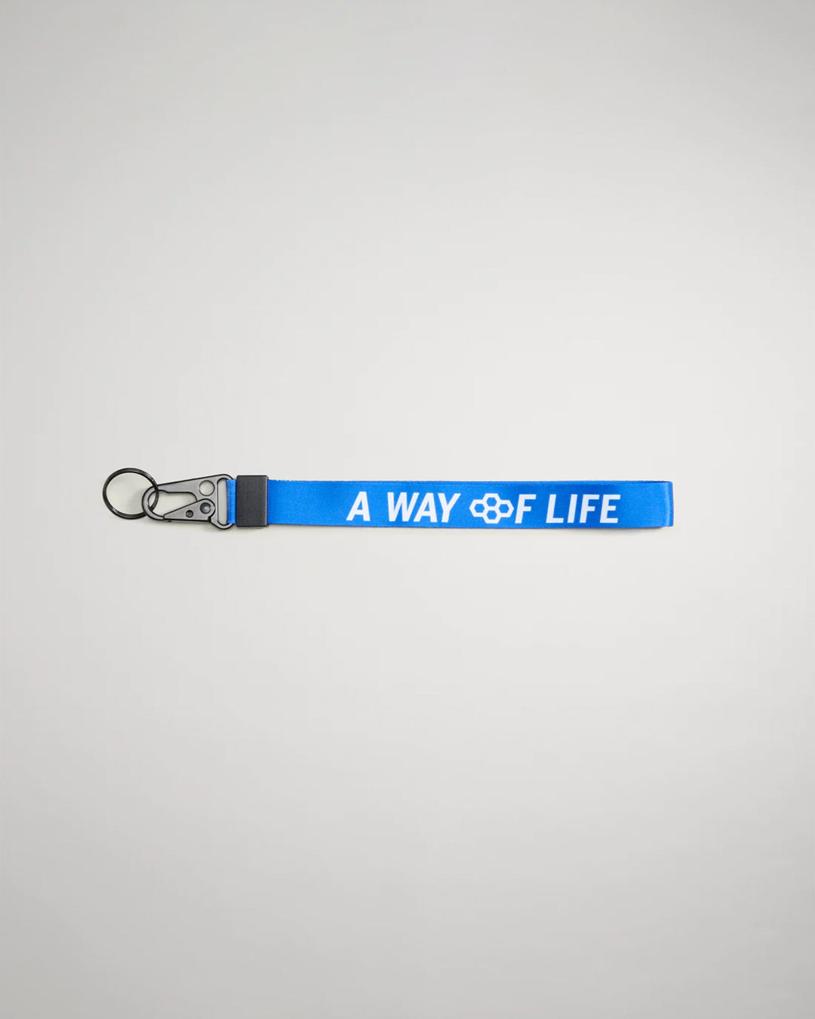 A vibrant blue keychain strap featuring the phrase A WAY OF LIFE in bold white letters designed for both style and utility