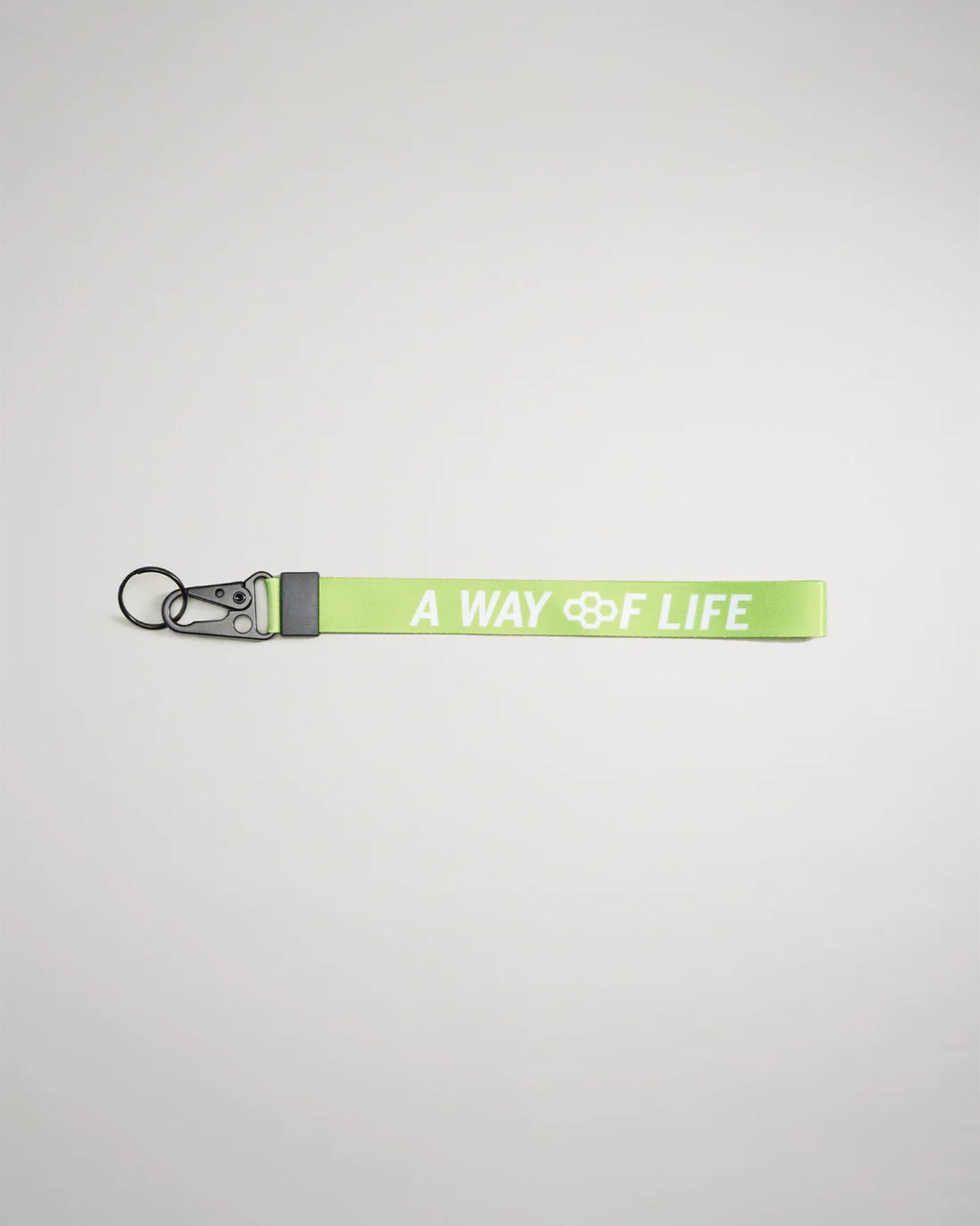 A vibrant green lanyard featuring the phrase A WAY OF LIFE in bold white letters equipped with a metal clip and keyring for secure attachment