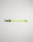 A vibrant green lanyard featuring the phrase A WAY OF LIFE in bold white letters equipped with a metal clip and keyring for secure attachment