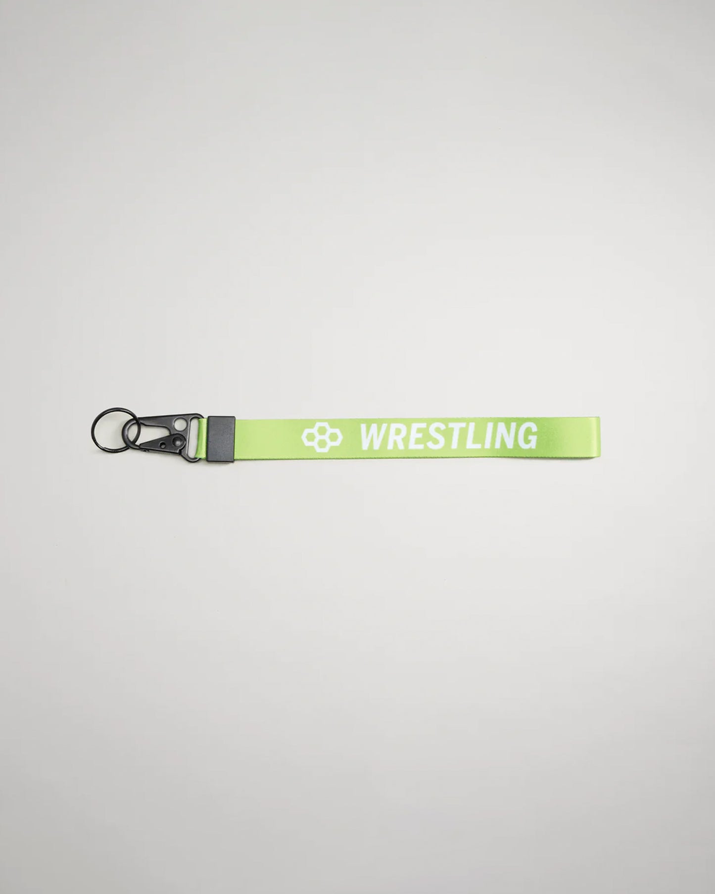 A vibrant green lanyard featuring the word WRESTLING in bold white letters ideal for sporting events or team identification