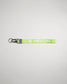 A vibrant green lanyard featuring the word WRESTLING in bold white letters ideal for sporting events or team identification
