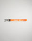 An orange lanyard featuring the phrase A WAY OF LIFE in white lettering with a metal clip and keyring attachment for versatility
