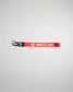 A vibrant red lanyard with the word WRESTLING printed in white featuring a black clip for attaching keys or ID cards
