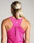 A woman is seen from behind wearing a vibrant pink tank top showcasing a sporty design with detailed stitching and a small logo at the back