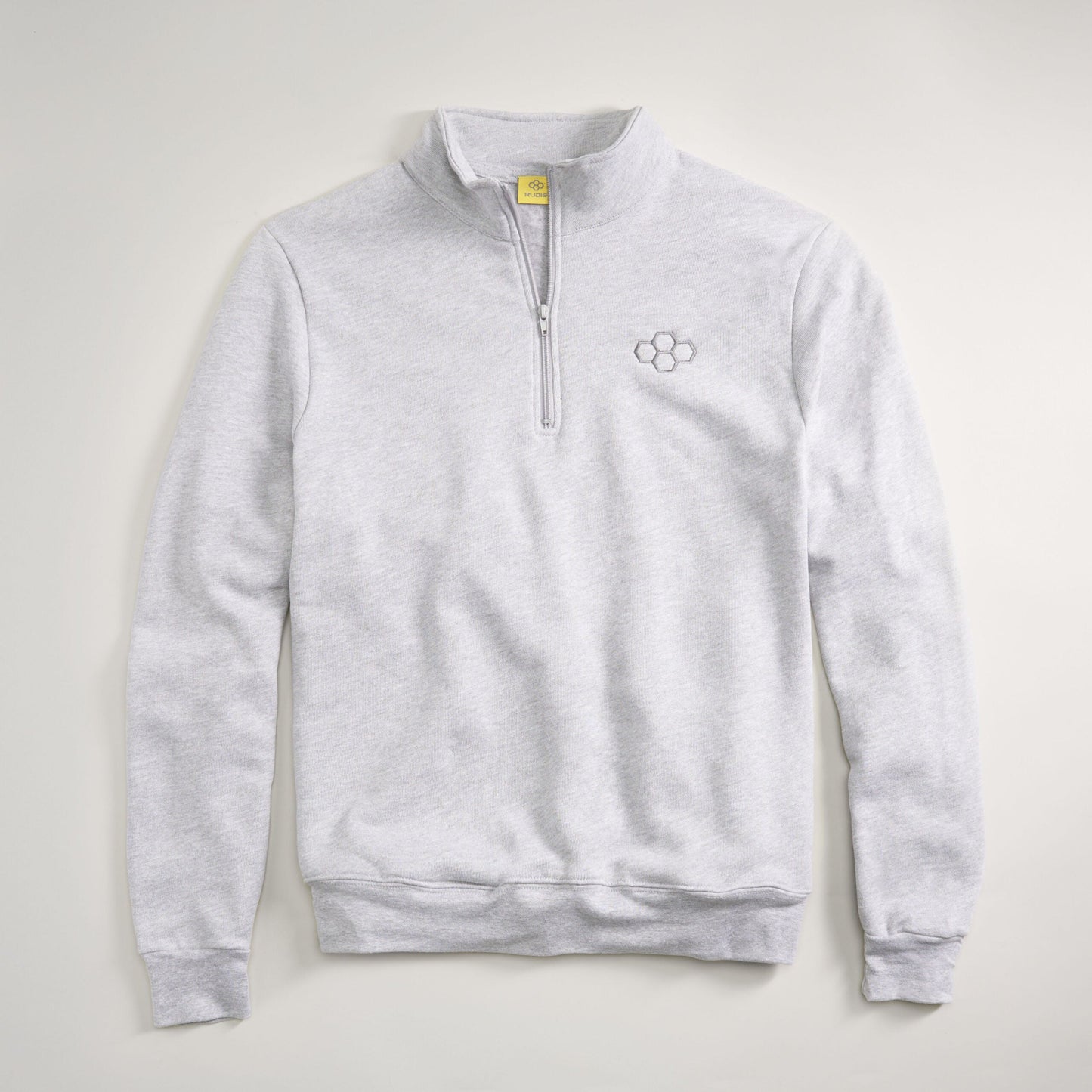 A light gray quarter-zip pullover made of soft fabric featuring a subtle logo on the chest