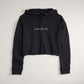 A cropped black hoodie featuring the phrase A WAY OF LIFE in a simple font designed for a casual and stylish look