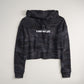 This image showcases a cropped black camouflage hoodie with the text A WAY OF LIFE prominently displayed on the front in white