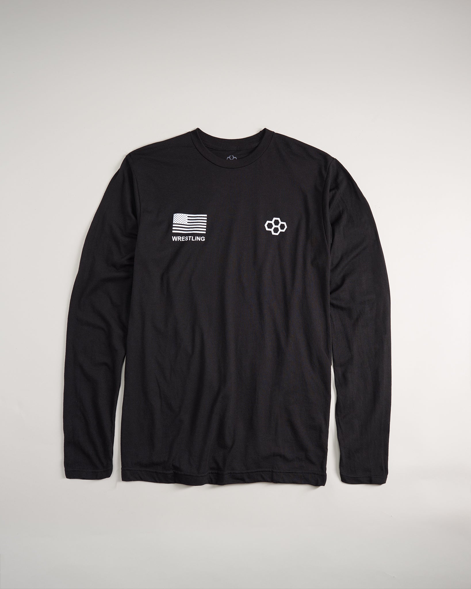 A black long-sleeve shirt featuring an American flag patch and WRESTLING text complemented by a stylized logo on the opposite side
