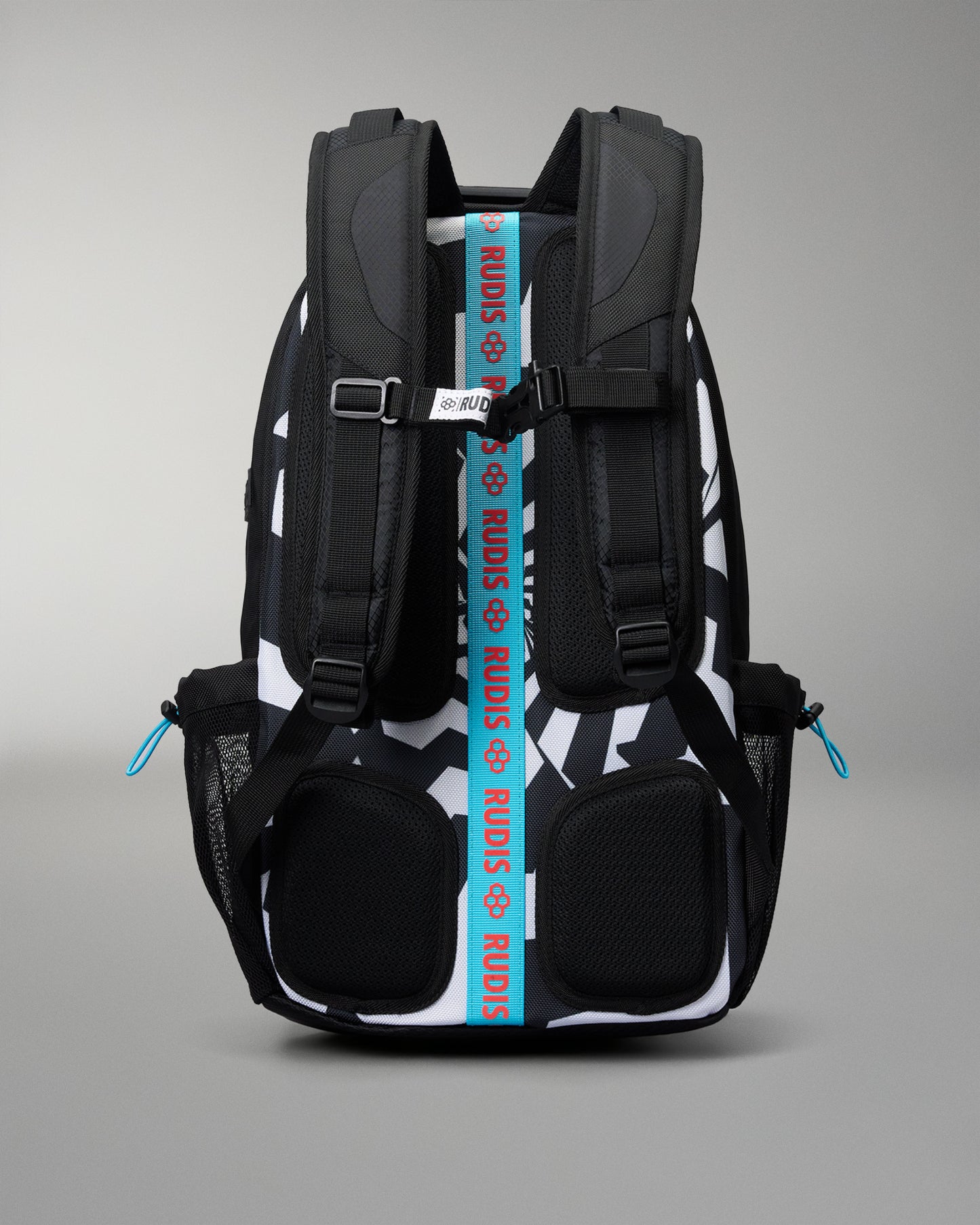 A black and white patterned backpack shown from the back, featuring a prominent bright blue vertical strap with the brand name 'RUDIS' printed in white, and small blue zipper pulls on the side mesh pockets.