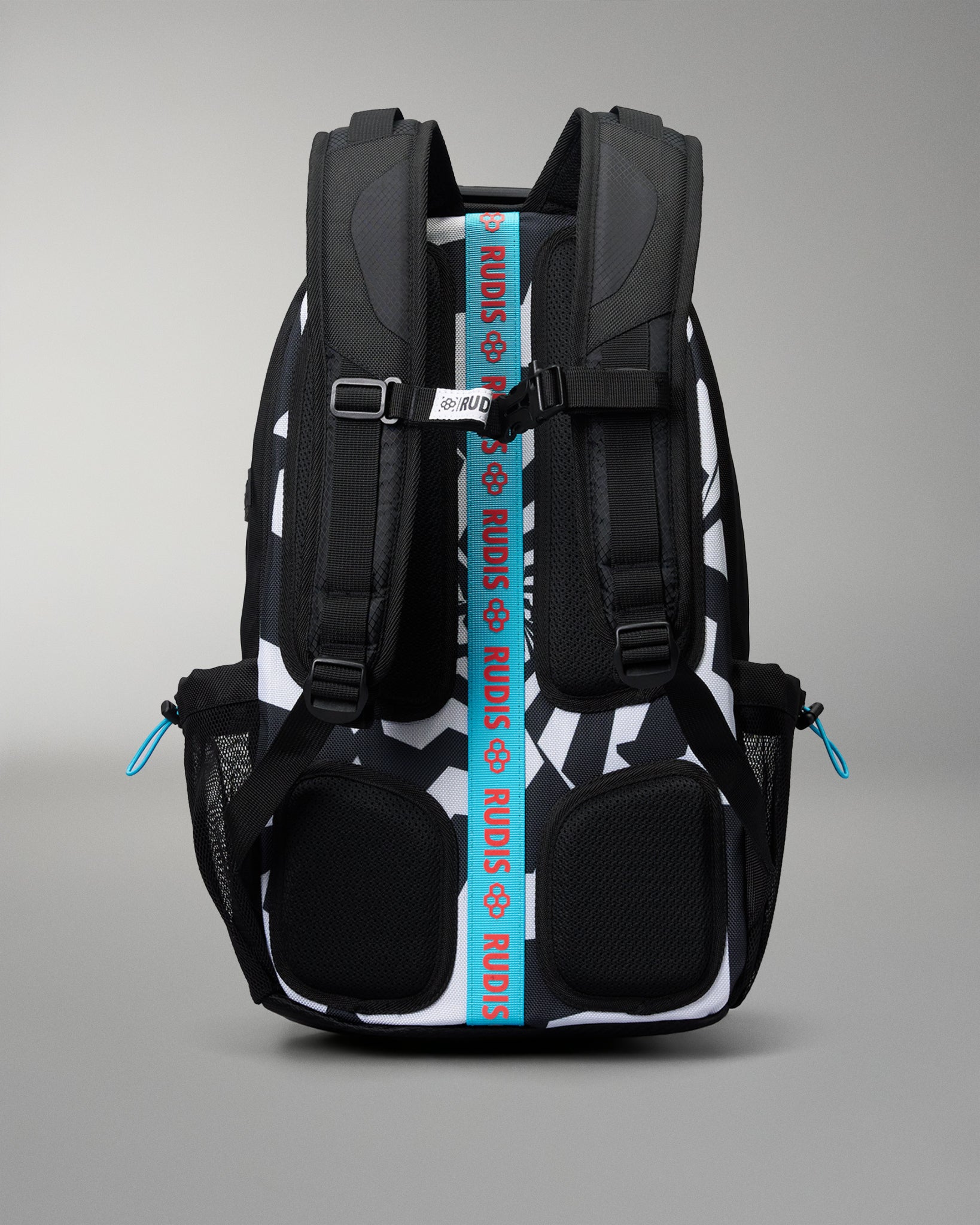 A black and white patterned backpack shown from the back, featuring a prominent bright blue vertical strap with the brand name 'RUDIS' printed in white, and small blue zipper pulls on the side mesh pockets.