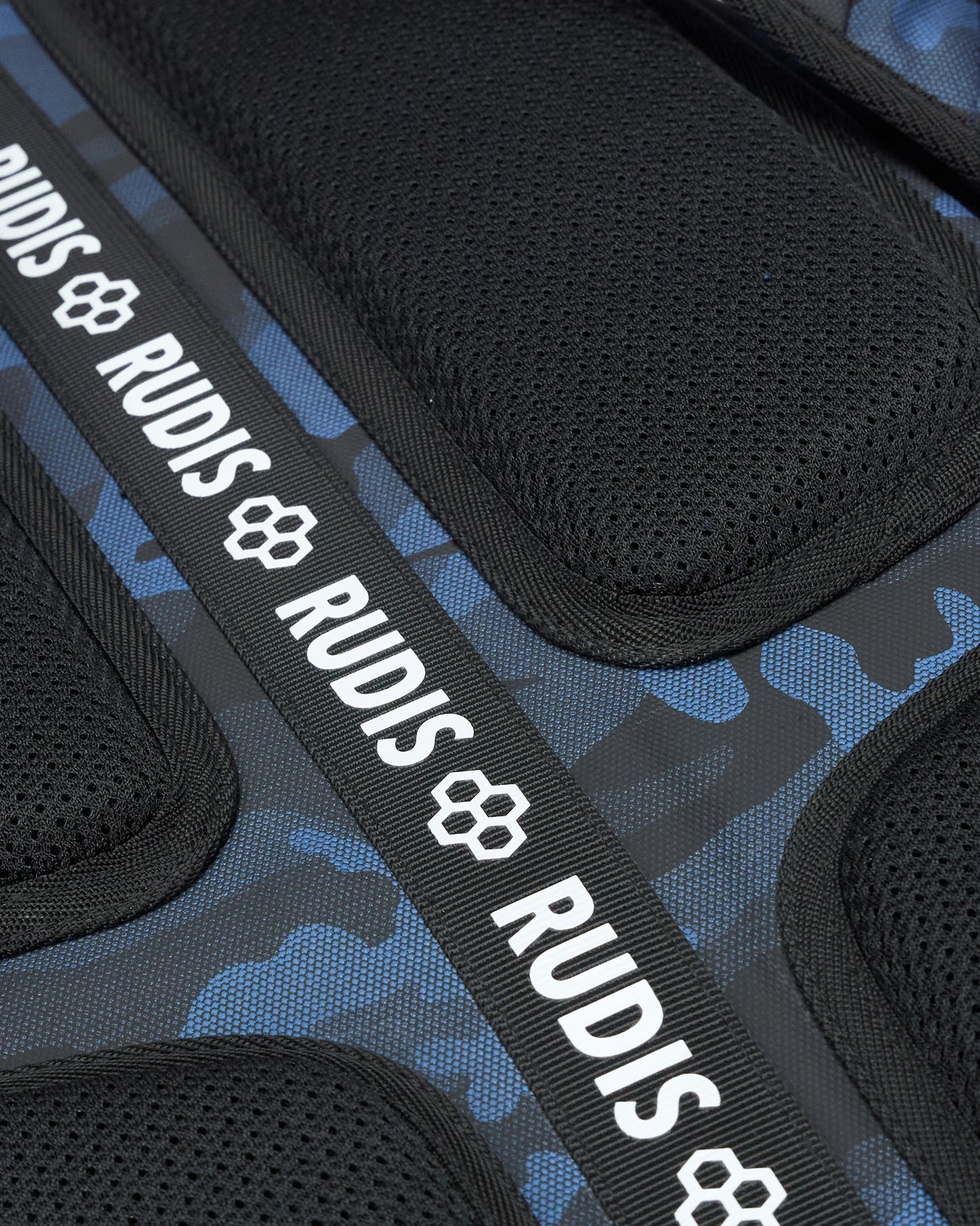 Close-up of a RUDIS protective gear with black and blue design