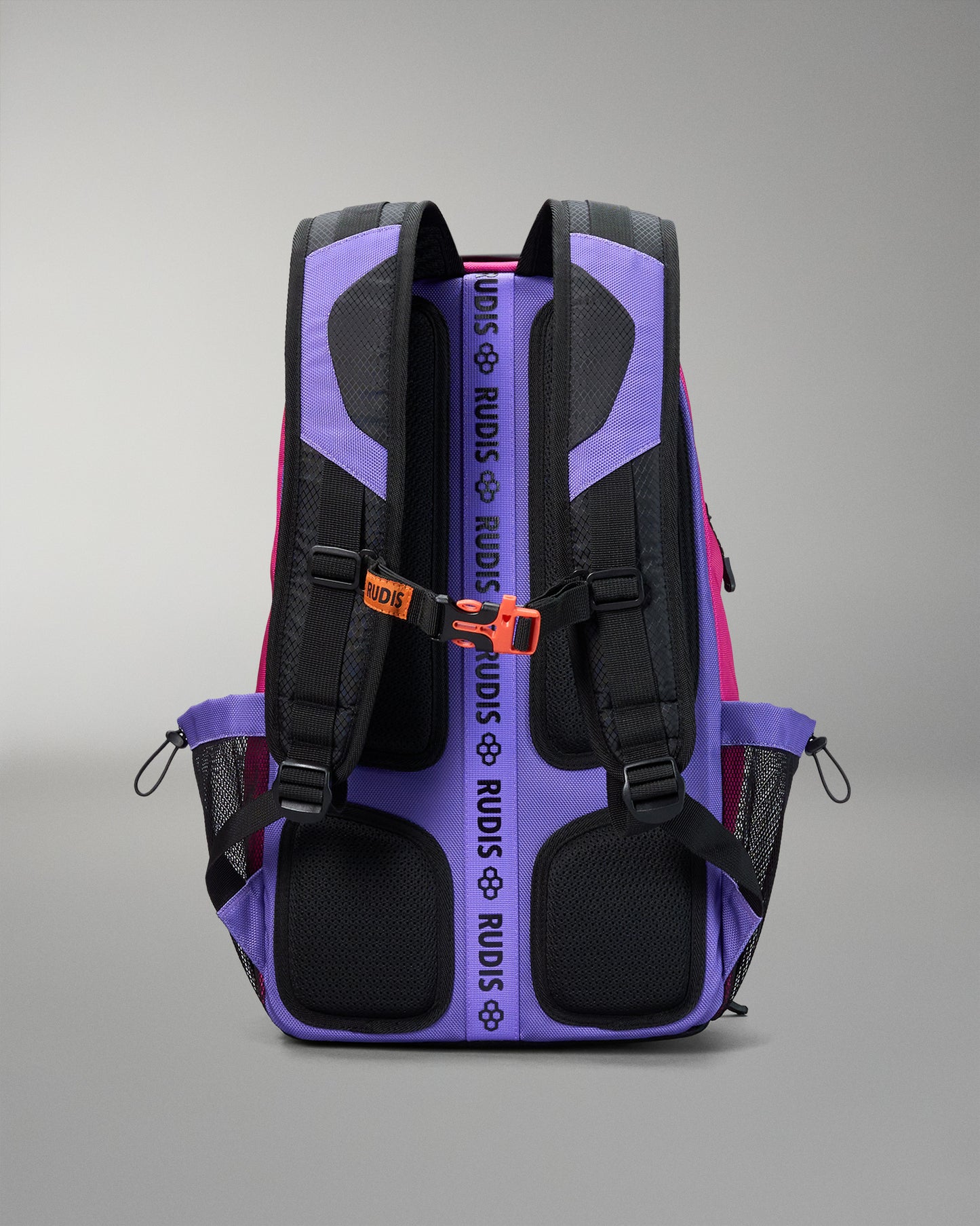 Purple and black backpack with visible branding on a gray background
