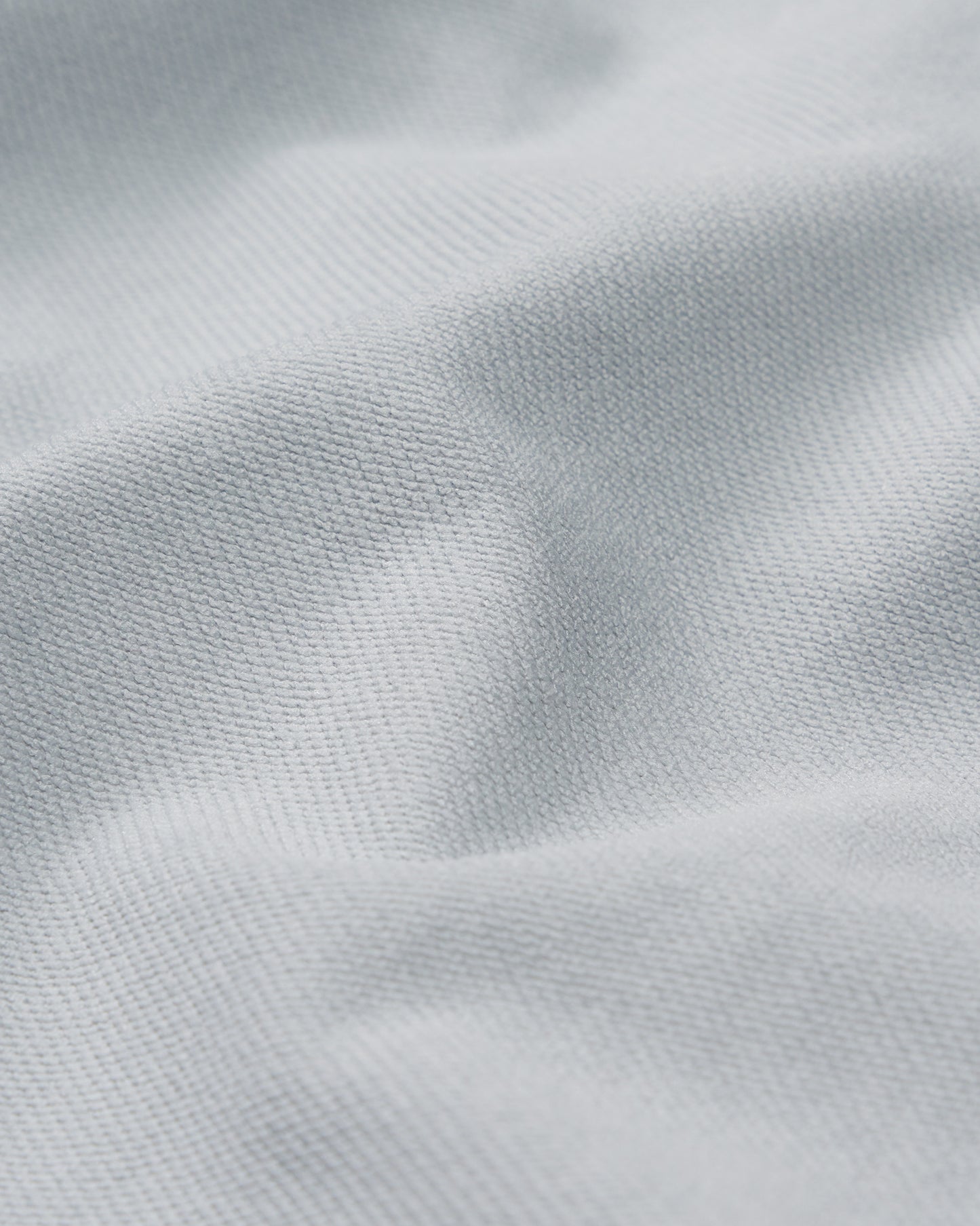 Close-up of light gray fabric texture