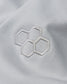 Close-up of a white fabric with embroidered hexagonal pattern