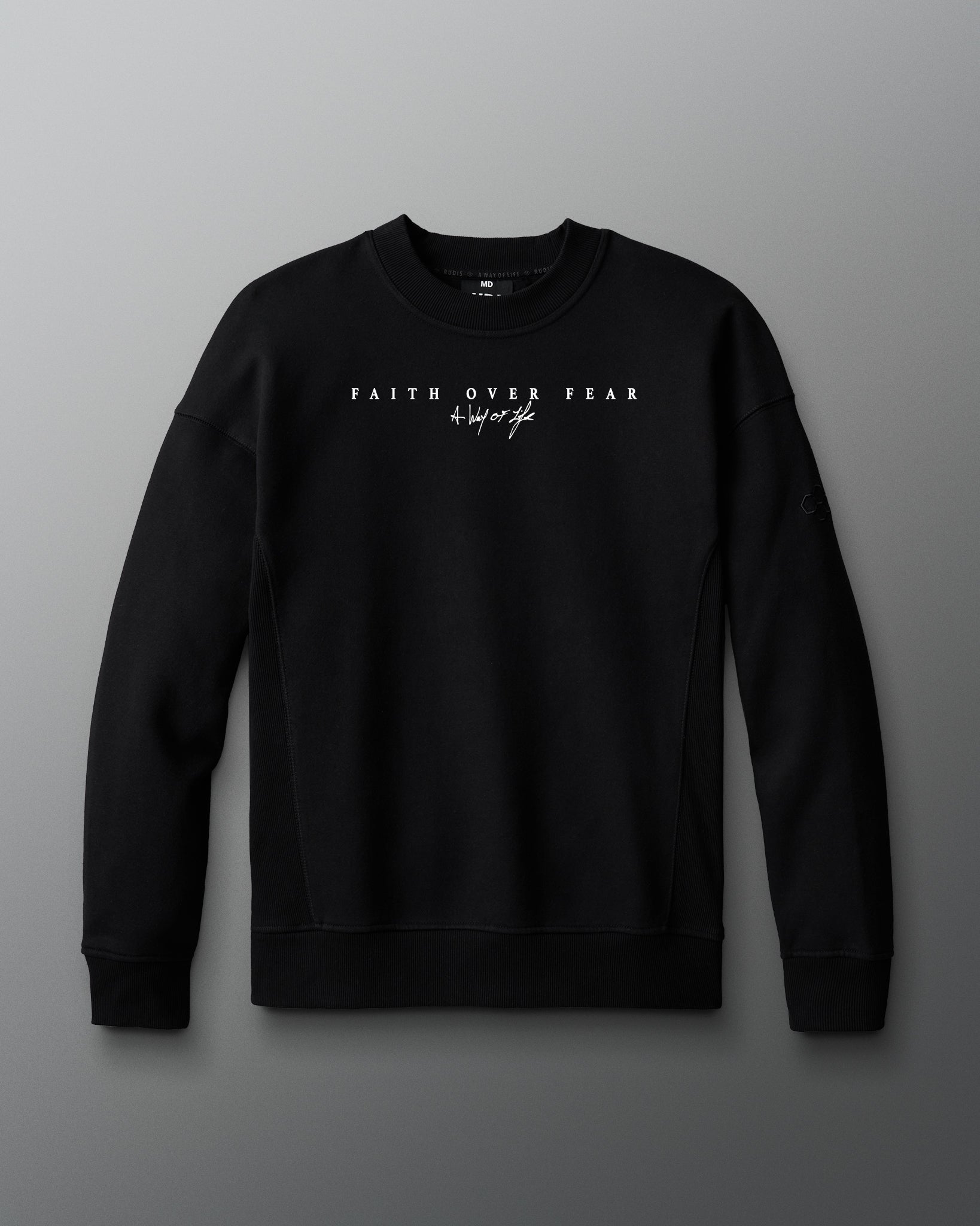 Black sweatshirt with text on a gray background. 