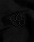Close-up of black fabric with embroidered hexagonal pattern