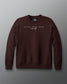 Brown sweatshirt with 'Faith Over Fear' text on a gray background