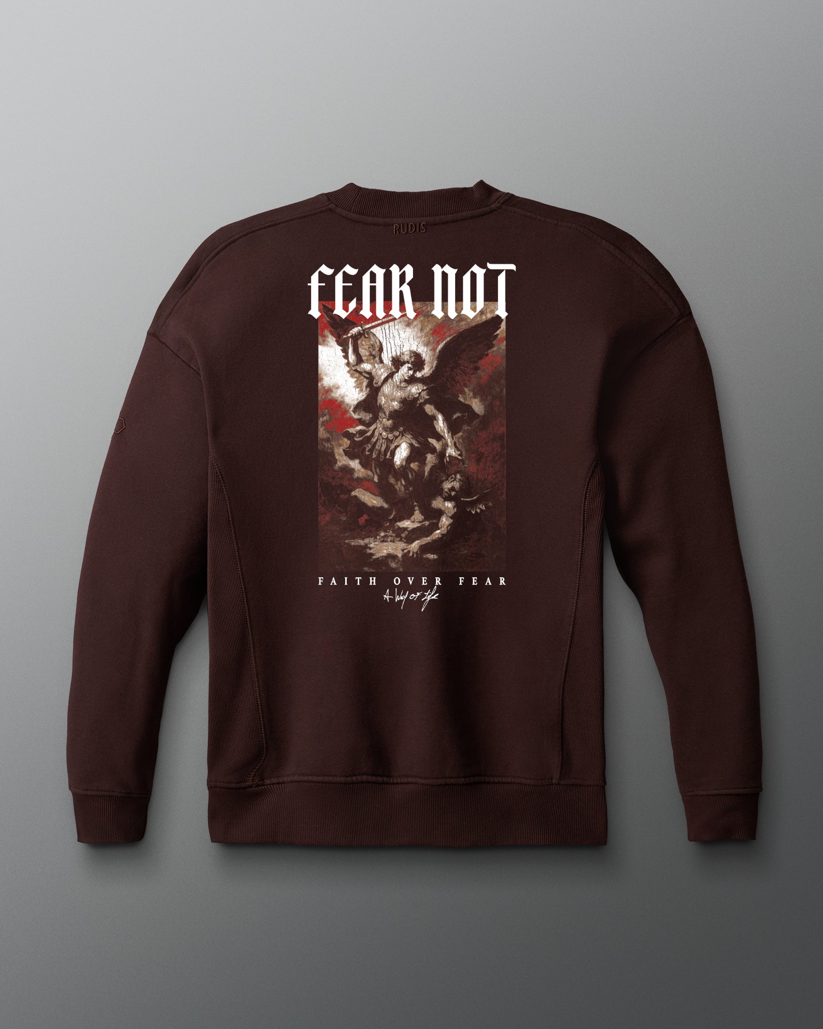 Brown sweatshirt with graphic design and text on a gray background