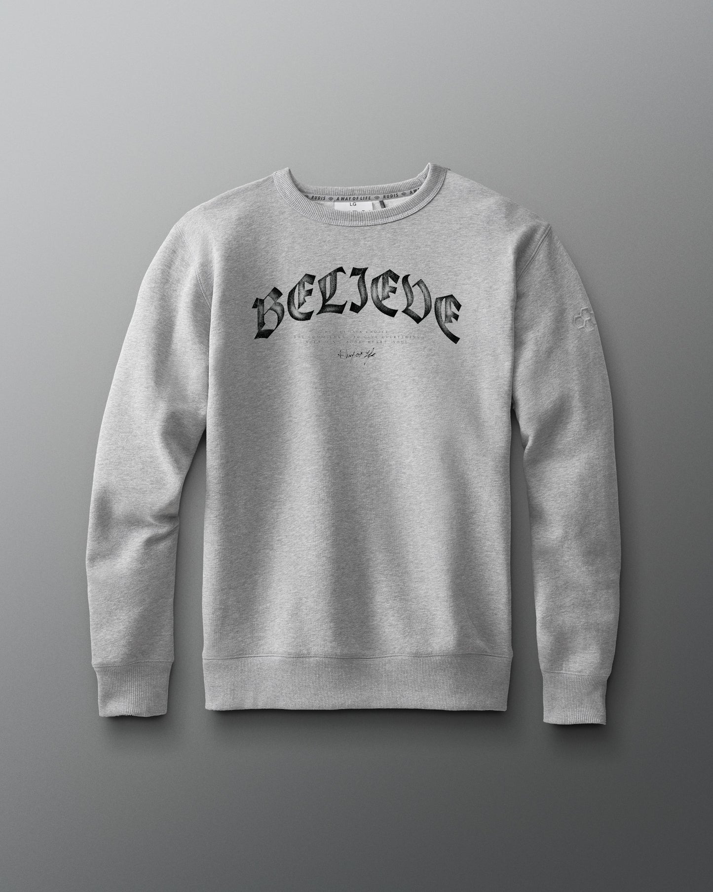 Gray sweatshirt with 'BELIEVE' text on a gray background