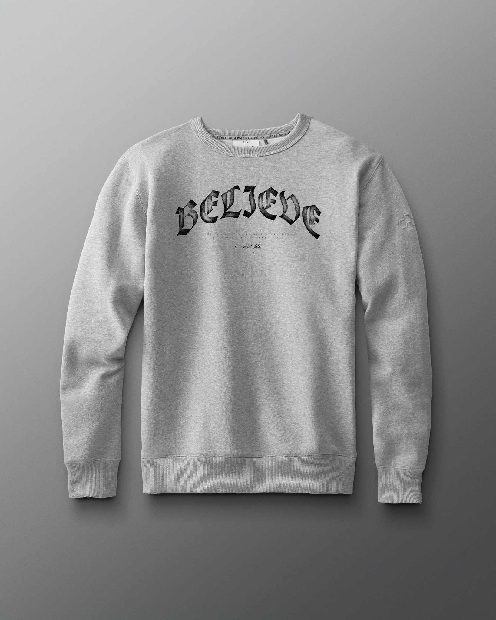 Gray sweatshirt with 'BELIEVE' text on a gray background