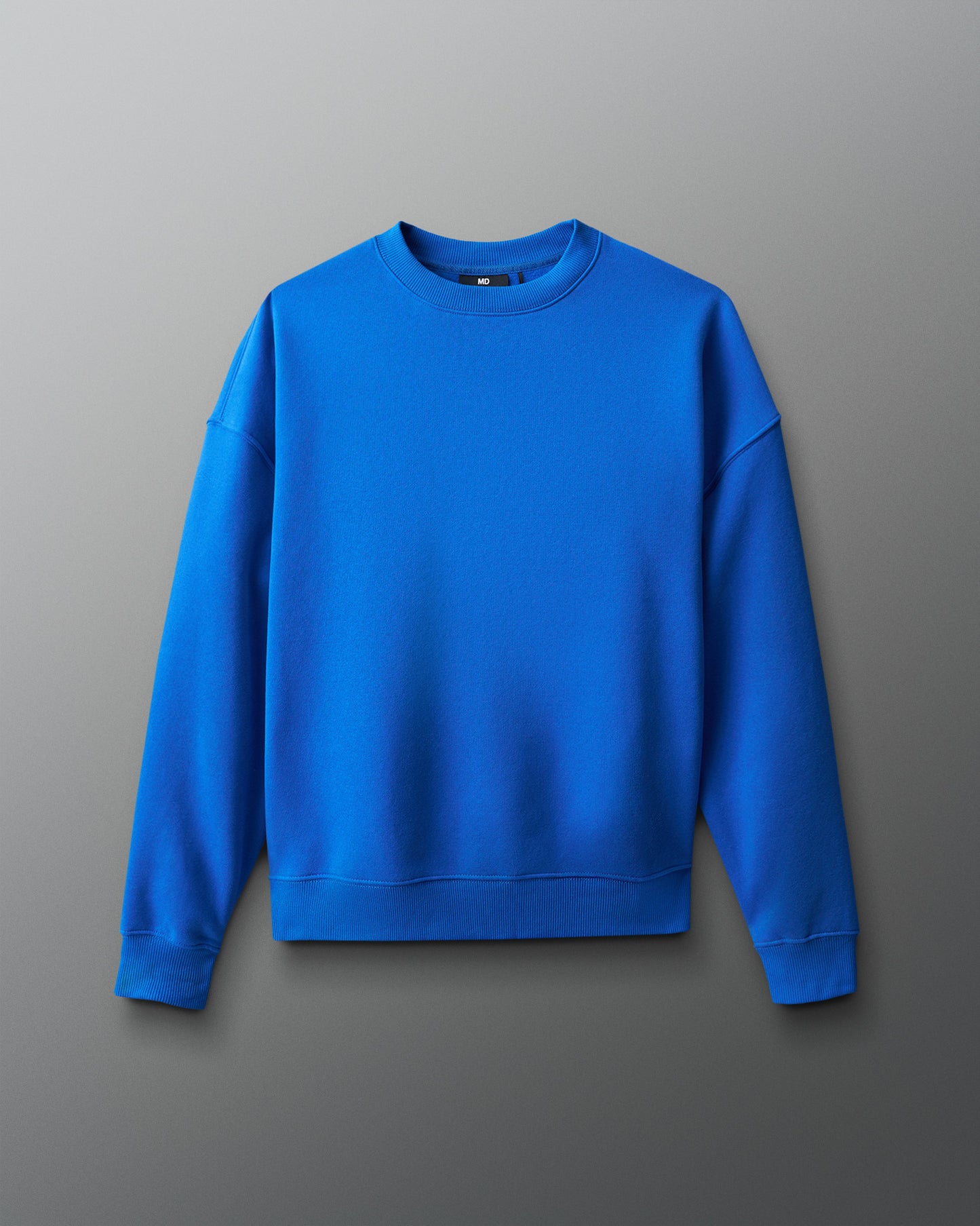 Blue sweatshirt on a gray background