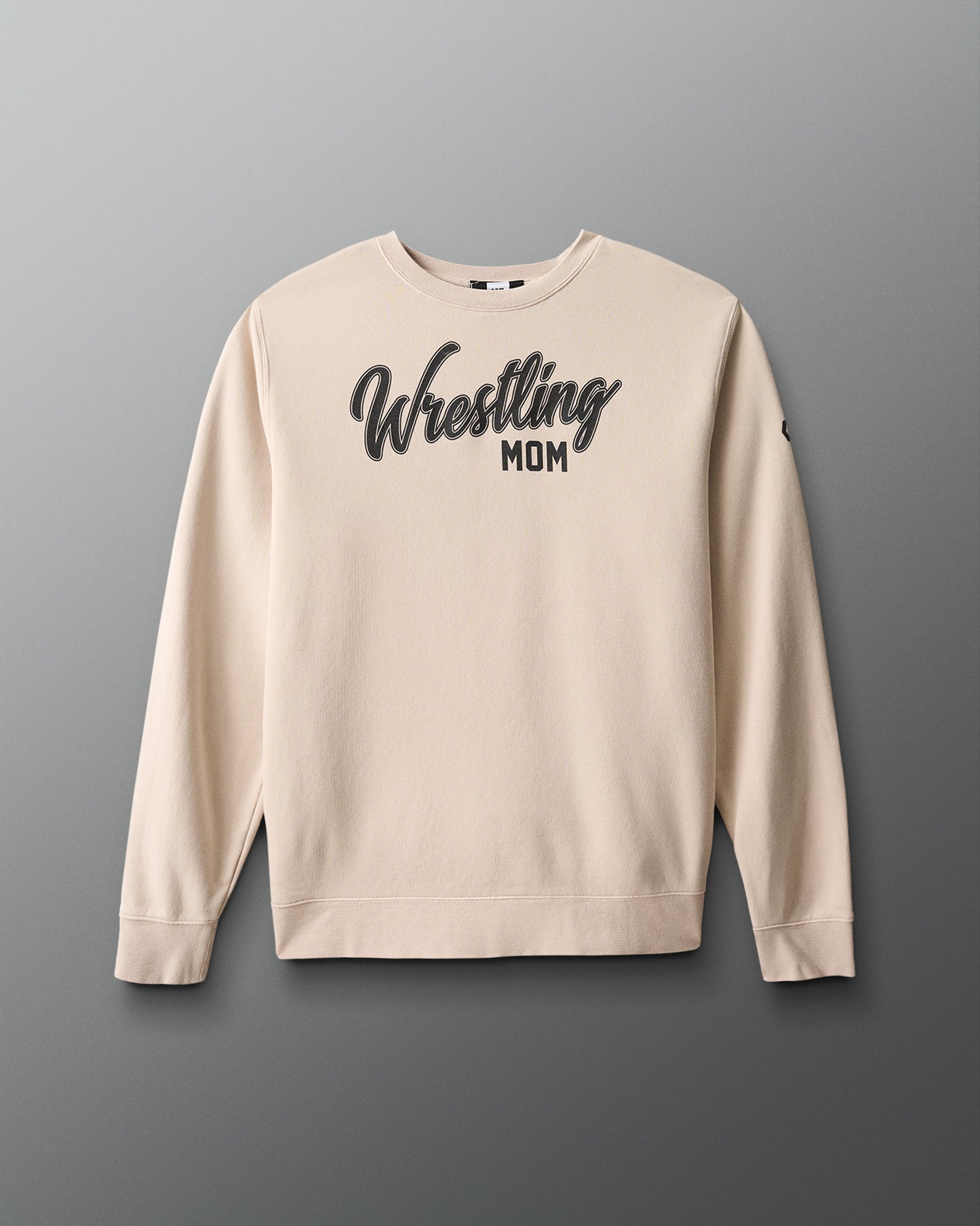 Beige sweatshirt with 'Wrestling Mom' text on a gray background
