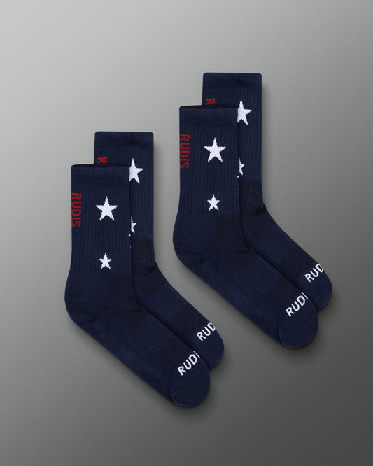 Navy socks with white star patterns and red text on a gray background