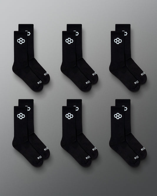 RUDIS Essential Hex Cushion Crew Socks 6-pack in black, featuring white RUDIS Hex logos at the crew and RUDIS branding at the toe.