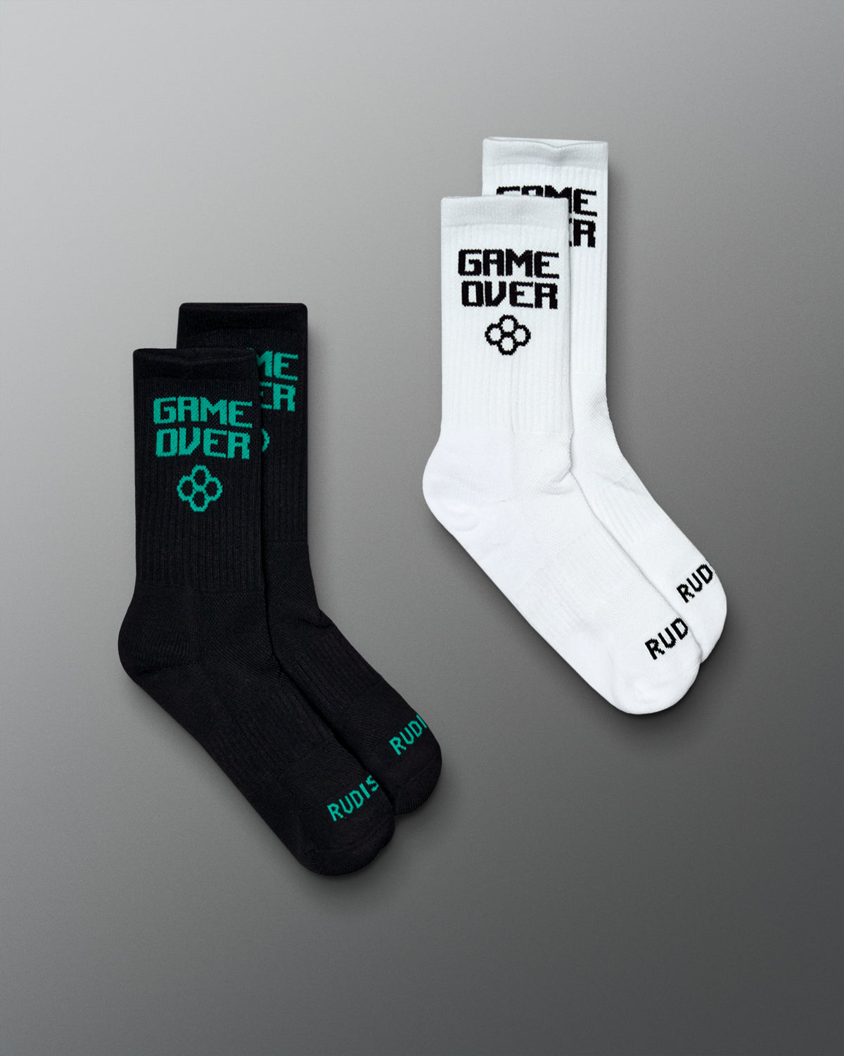 Arcade Cushion Crew Socks two-pair set in black and white, featuring “GAME OVER” graphics and RUDIS branding.
