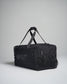 A sturdy black utility duffel bag with adjustable straps and a zippered compartment designed for practical use and versatile storage
