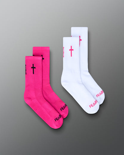 Two pairs of socks, one pink and one white, with text and symbols on a gray background.