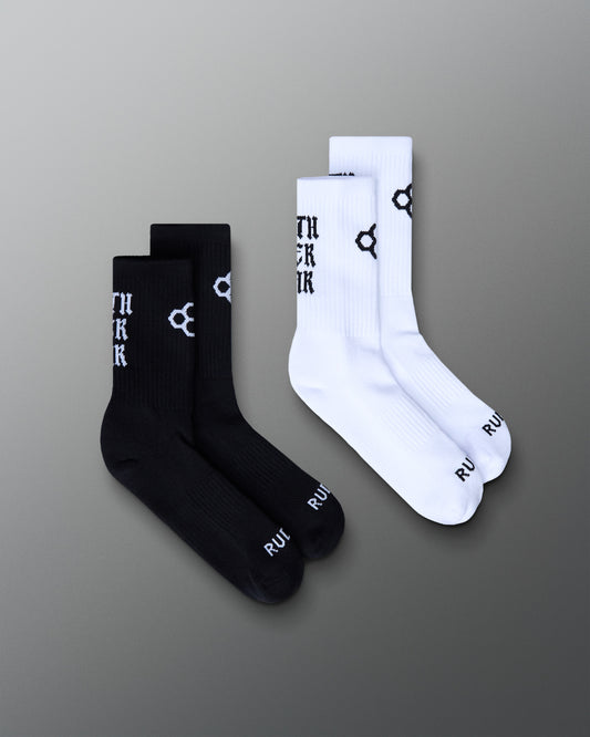 Black and white socks with branding on a gray background